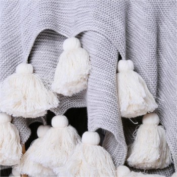Light throw with pom poms