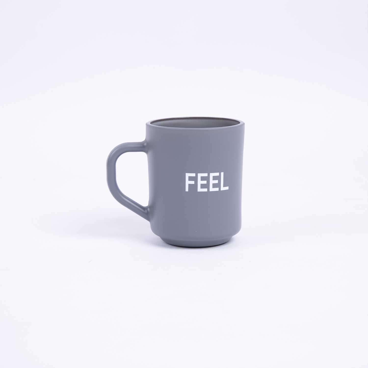 كوب قهوة بعبارة Feel من اورورا