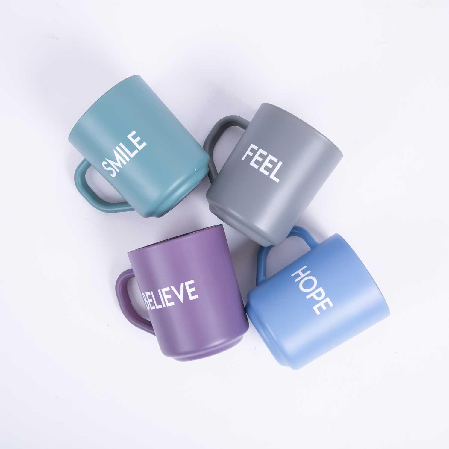 كوب قهوة بعبارة Believe  من اورورا