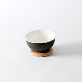 Metal serving bowl with wood base