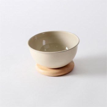 Metal serving bowl with wood base
